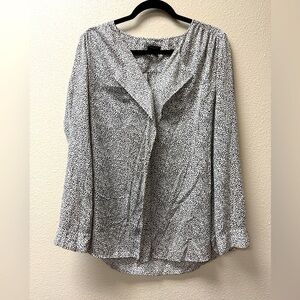 Ann Taylor long sleeved blouse. Black and white. Size 10 with stylish ruffles.